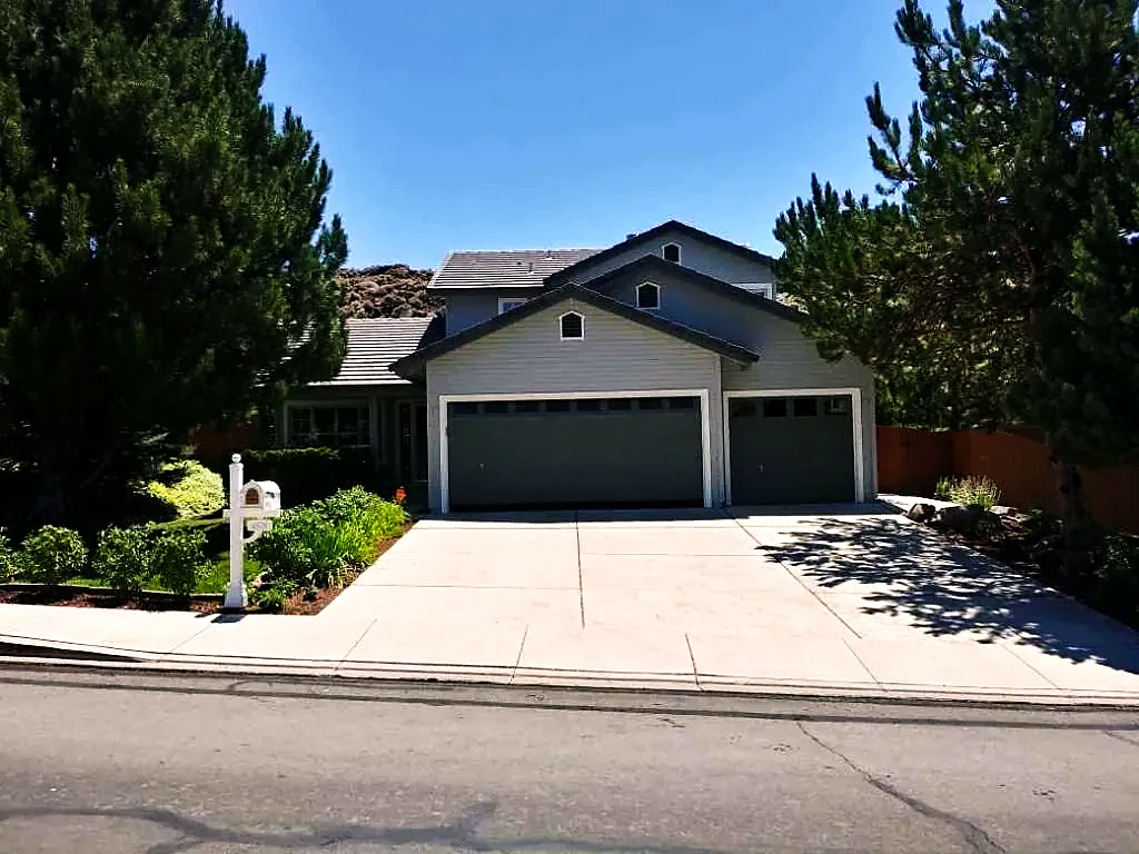 Grey two‑tone single‑storey home with fresh exterior paint